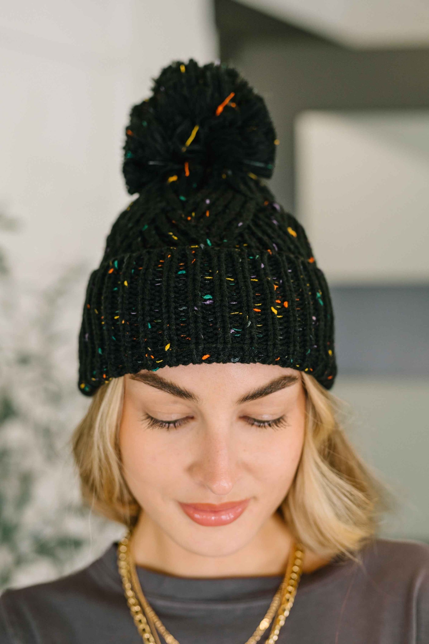 Cover Your Ears Pom Pom Beanie in Black