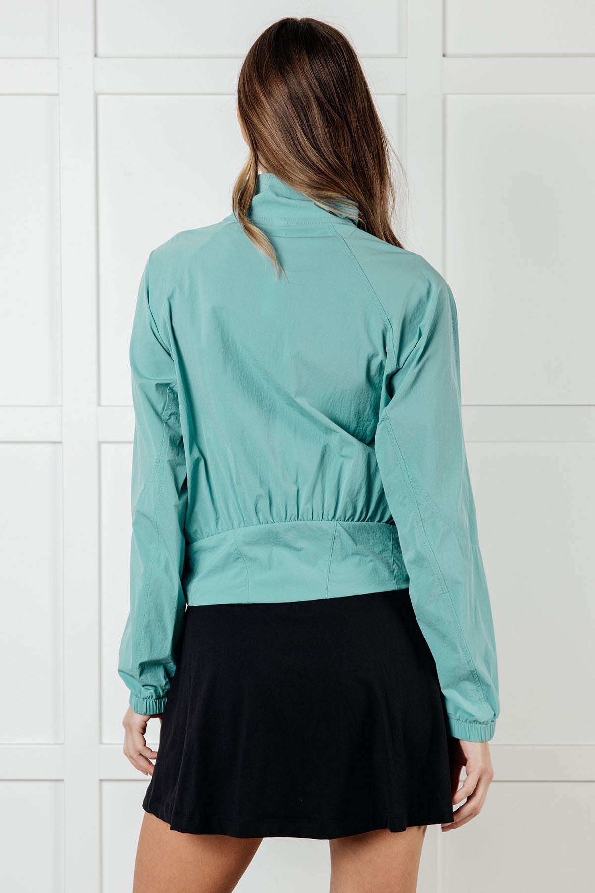 Chaqueta de tenis de nailon Fit Happens en color Tidal Wave