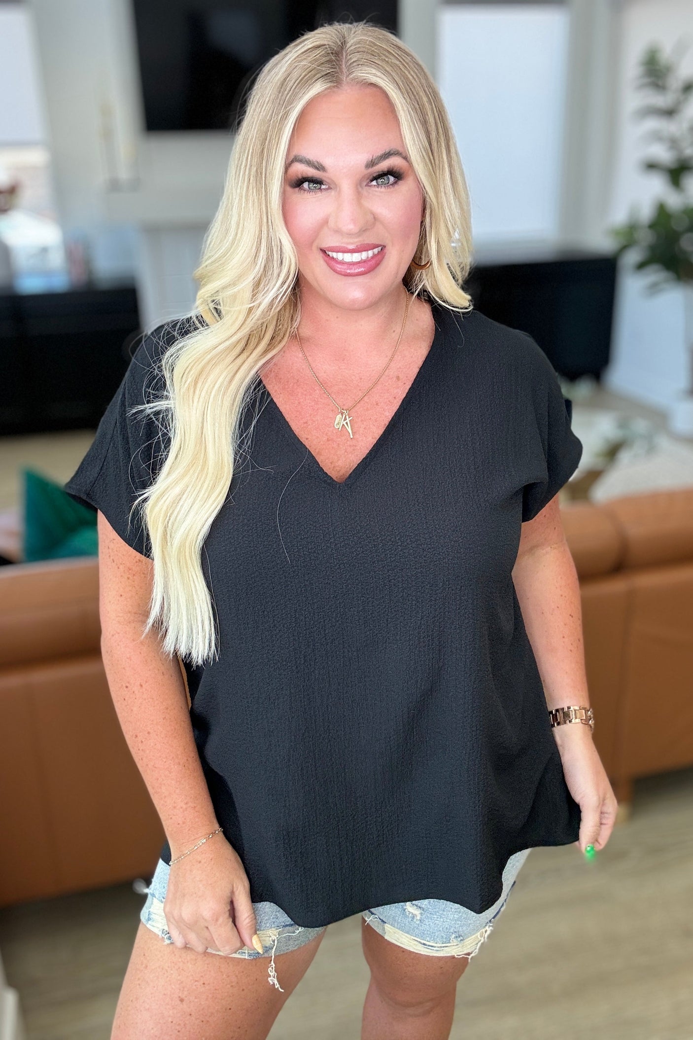 Top de cuello en V "Let Me Be Your Wings" en negro