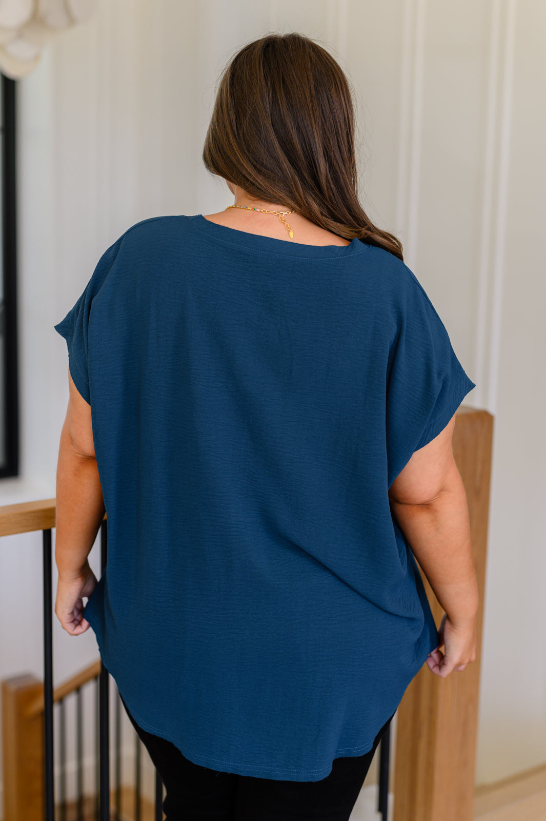 Top con cuello en V muy necesario en color verde azulado