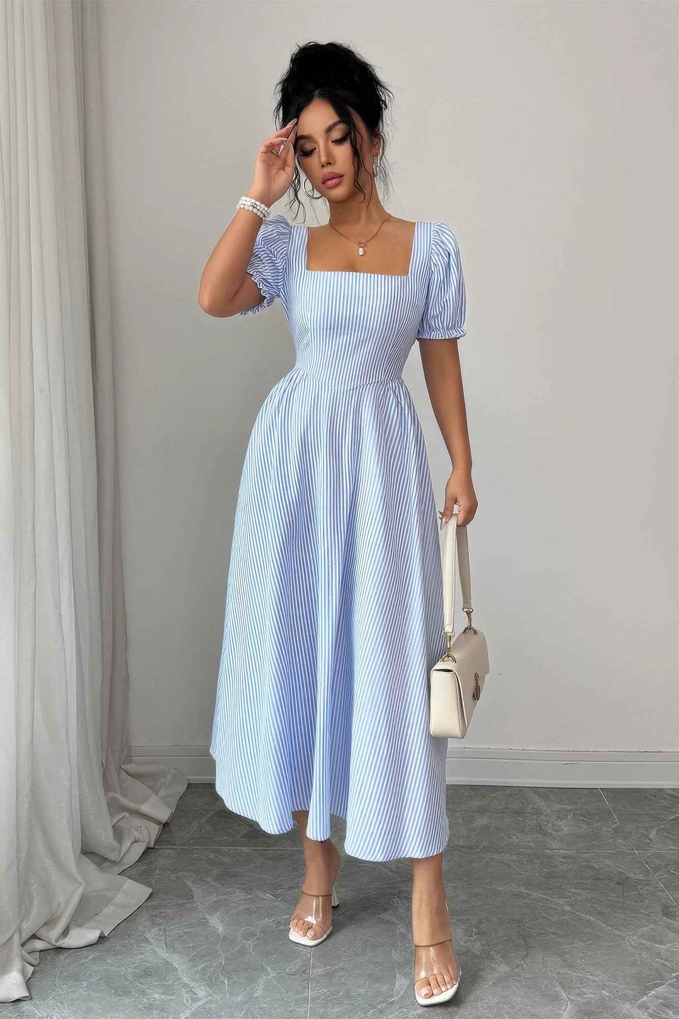 Sky blue striped puff sleeve dress from Liarian Unlimited Boutique