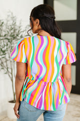 Blusa con mangas abullonadas de Chromatide en menta/naranja