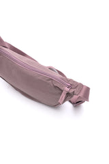 Minibolso bandolera redondo Essentially Everything en color lavanda