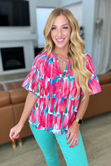 Blusa con cuello en V de exhibición de arte