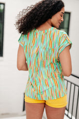 Blusa de manga corta Lizzy en rayas multicolor lima y esmeralda
