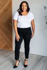 Pantalones pitillo negros con corte tobillero mágico