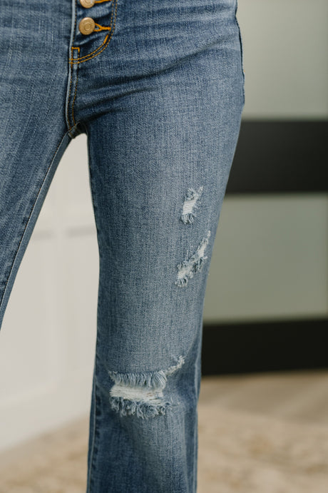 Pantalón acampanado de tiro medio con botones y bajo deshilachado Marion