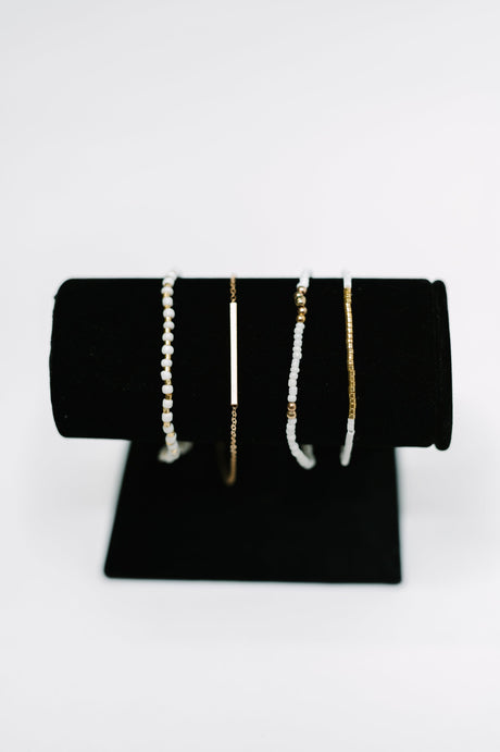 Conjunto de pulsera elegante y pulida en oro blanco y dorado