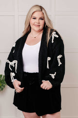 Cárdigan de punto grueso con corazón inquieto