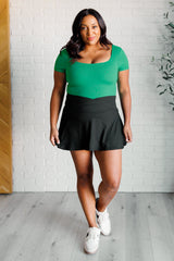 Body de cuello cuadrado "No son como nosotros" en verde esmeralda