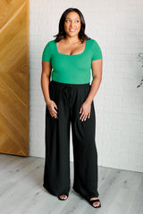 Body de cuello cuadrado "No son como nosotros" en verde esmeralda