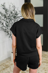 Conjunto de top y pantalones cortos con media cremallera de veinticuatro quilates