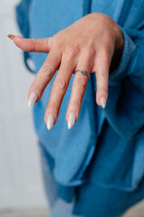 Envuelto en un anillo de rosa